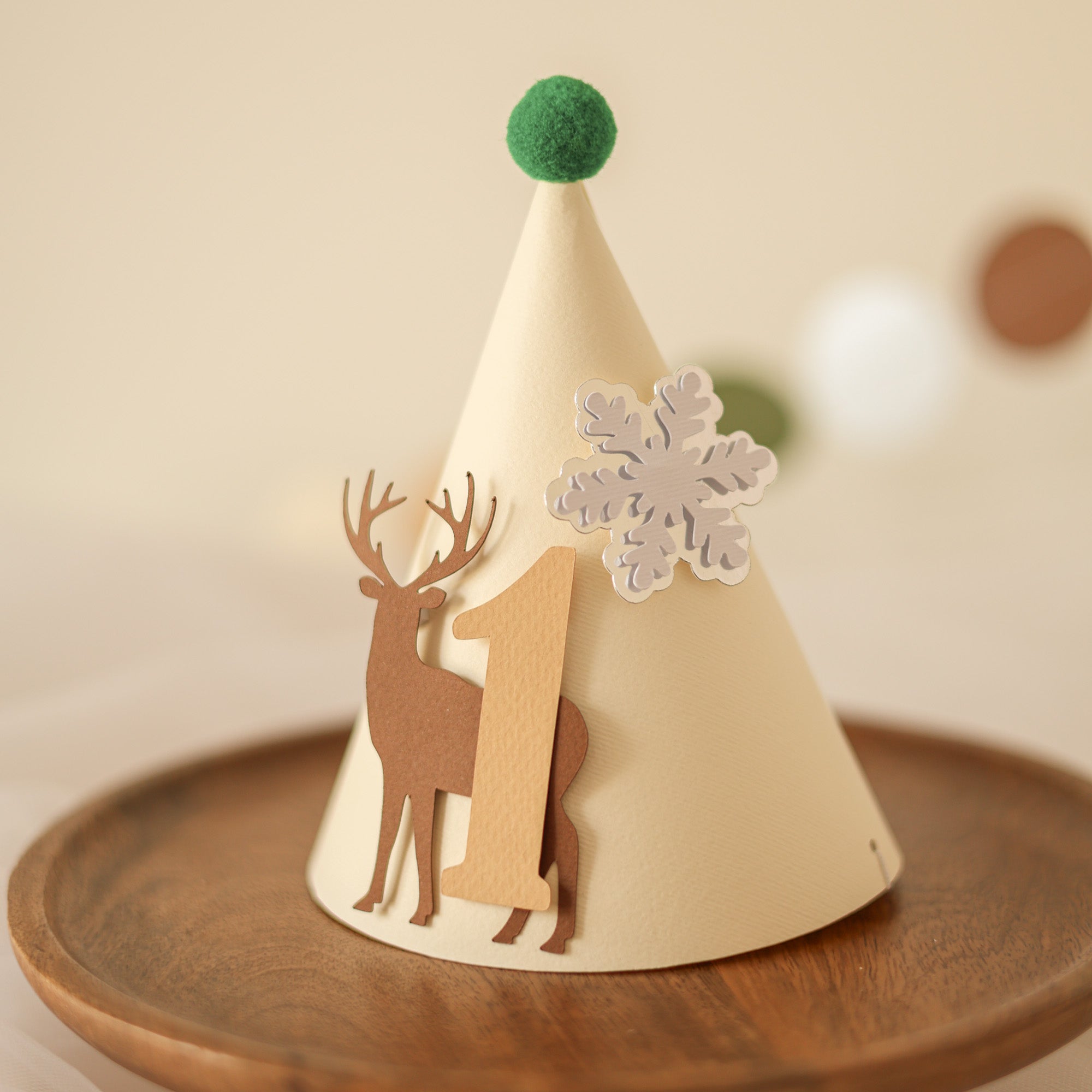 Beige party hat with deer design and snowflake