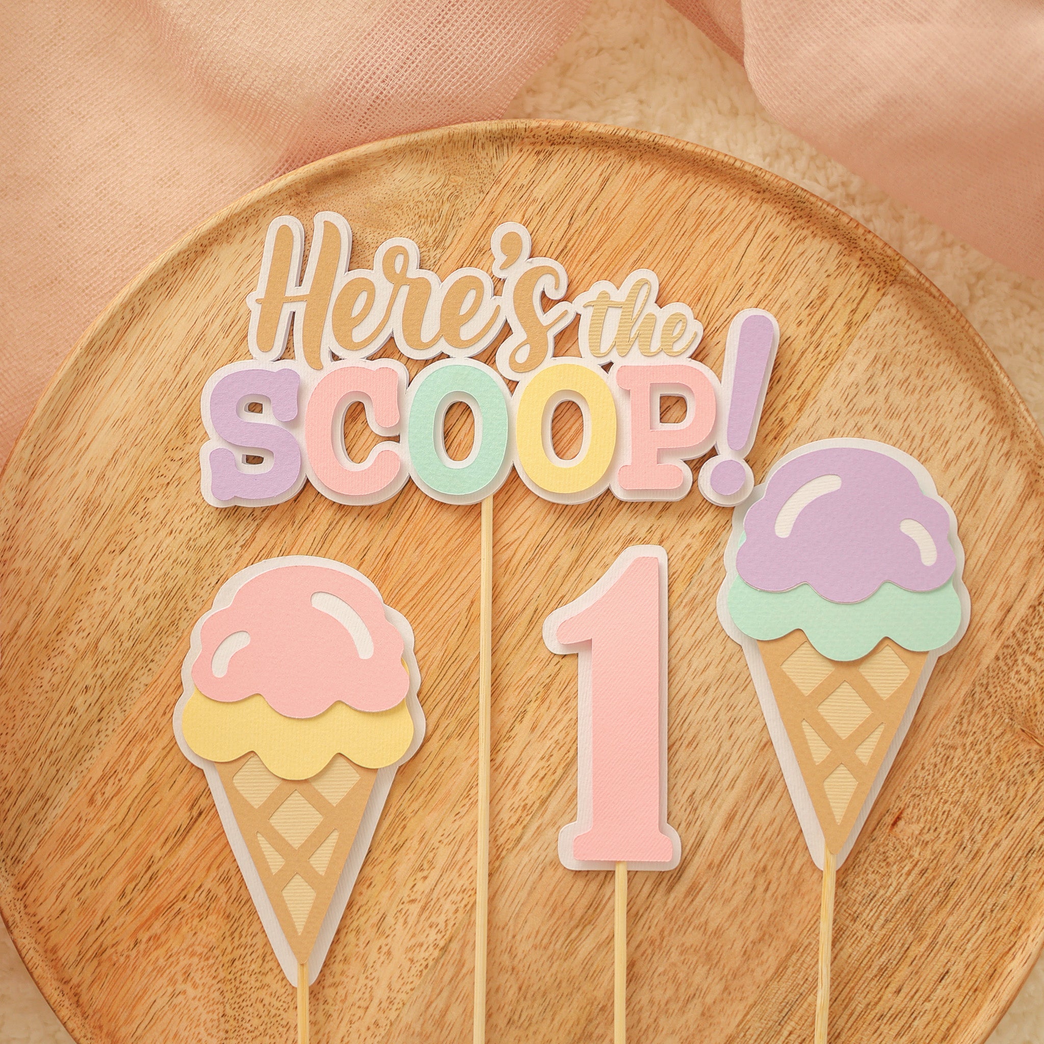 Collection of adorable ice cream themed decor for birthdays and "Sweet One" celebrations, banners, cupcake toppers, party hats and garlands