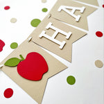 Detailed red apple cardstock pennant on kraft birthday banner