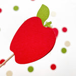 Close-up of red cardstock apple cupcake topper with green leaf