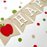 White letter on kraft paper pennant with red apple accent