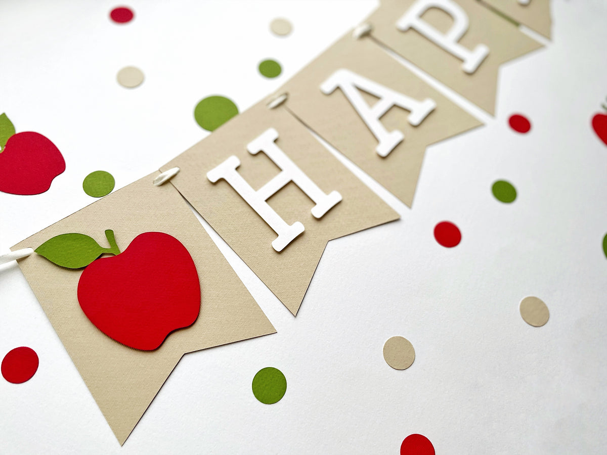 White letter on kraft paper pennant with red apple accent