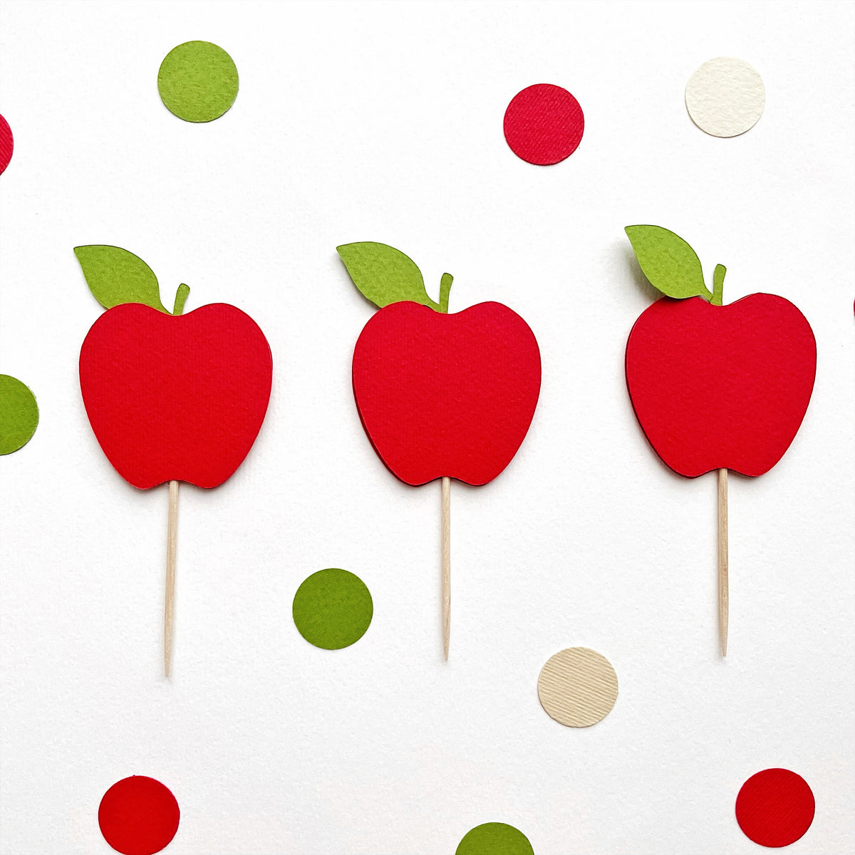 Set of three red apple cupcake toppers with wooden picks