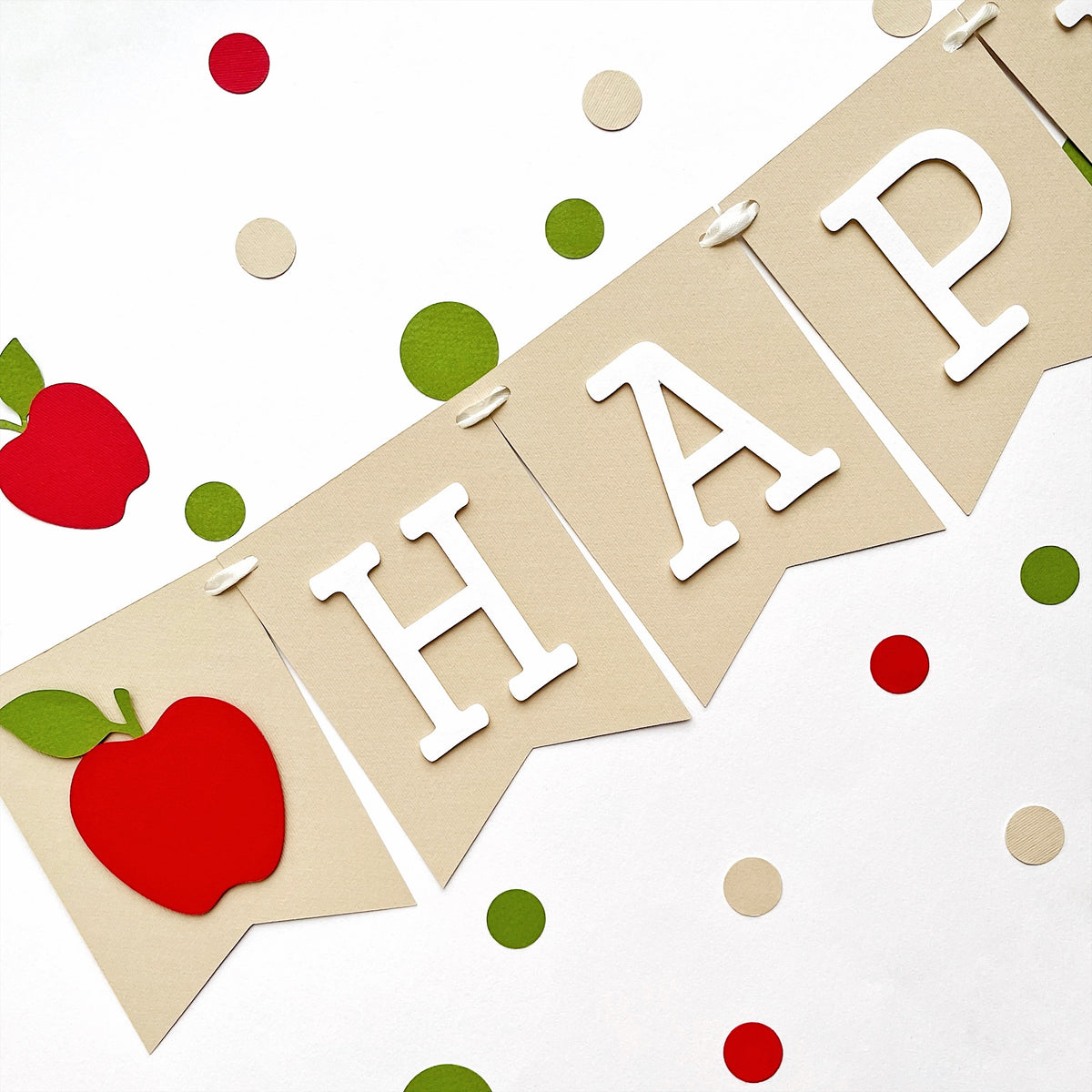 Close up of Apple of My Eye party garland pennants