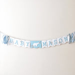 Polar Bear Baby Shower Name Banner in white and dusty blue for a winter gender reveal party.