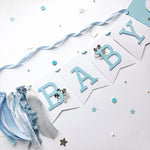 Polar Bear Baby Shower Name Banner in white and dusty blue for a winter gender reveal party.