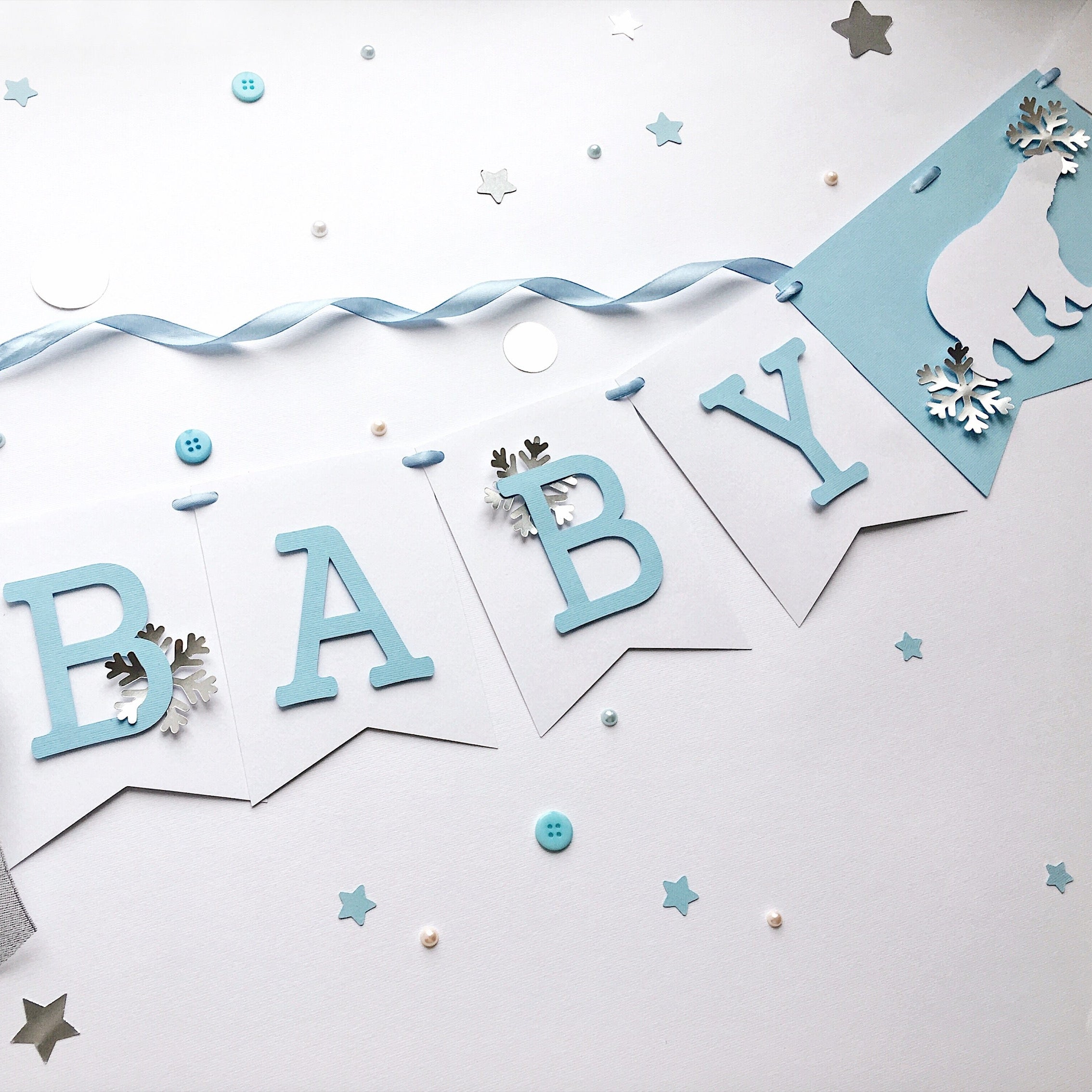 Polar Bear Baby Shower Name Banner in white and dusty blue for a winter gender reveal party.