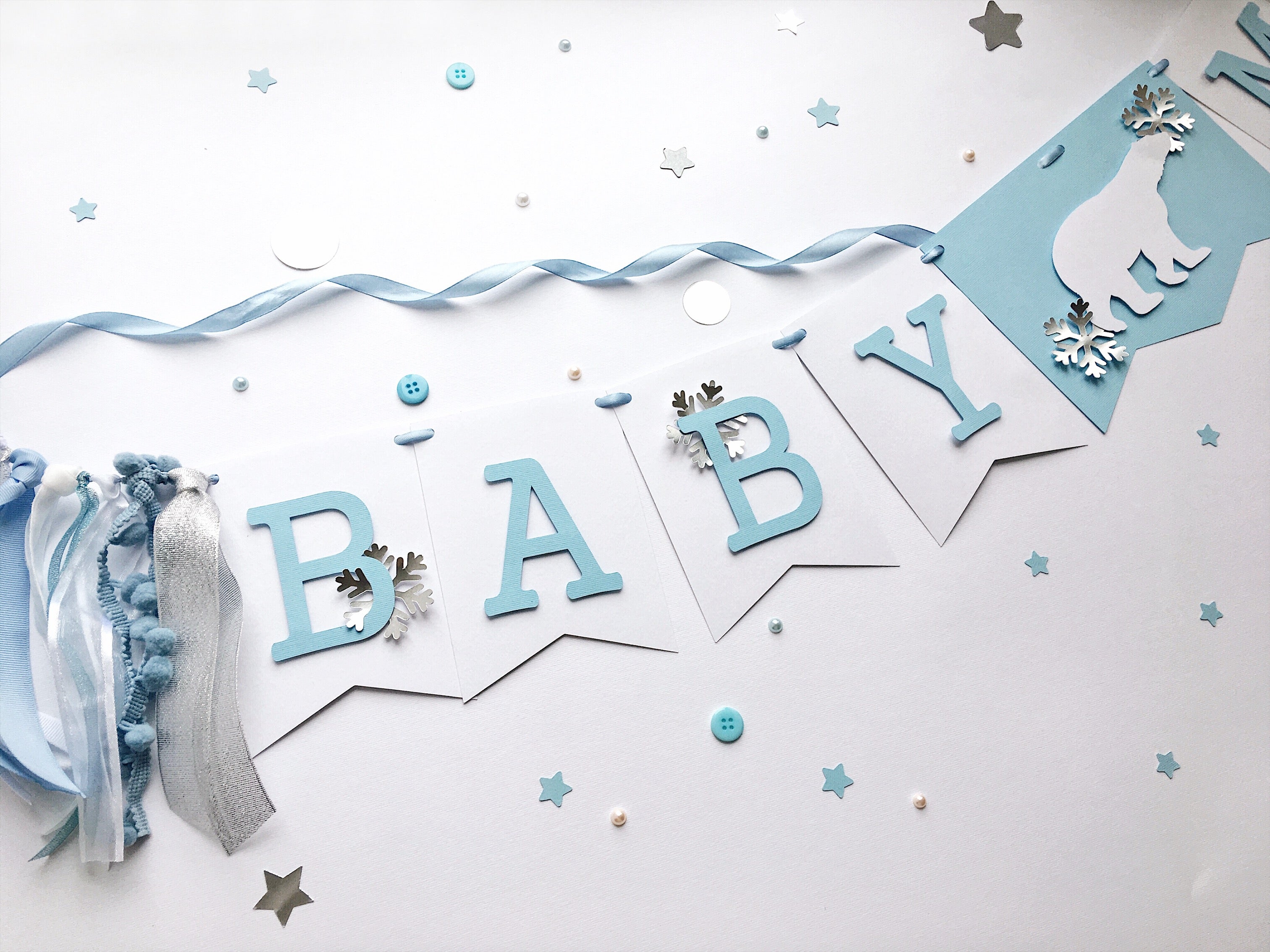 Polar Bear Baby Shower Name Banner in white and dusty blue for a winter gender reveal party.