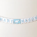Polar Bear Baby Shower Name Banner in white and dusty blue for a winter gender reveal party.