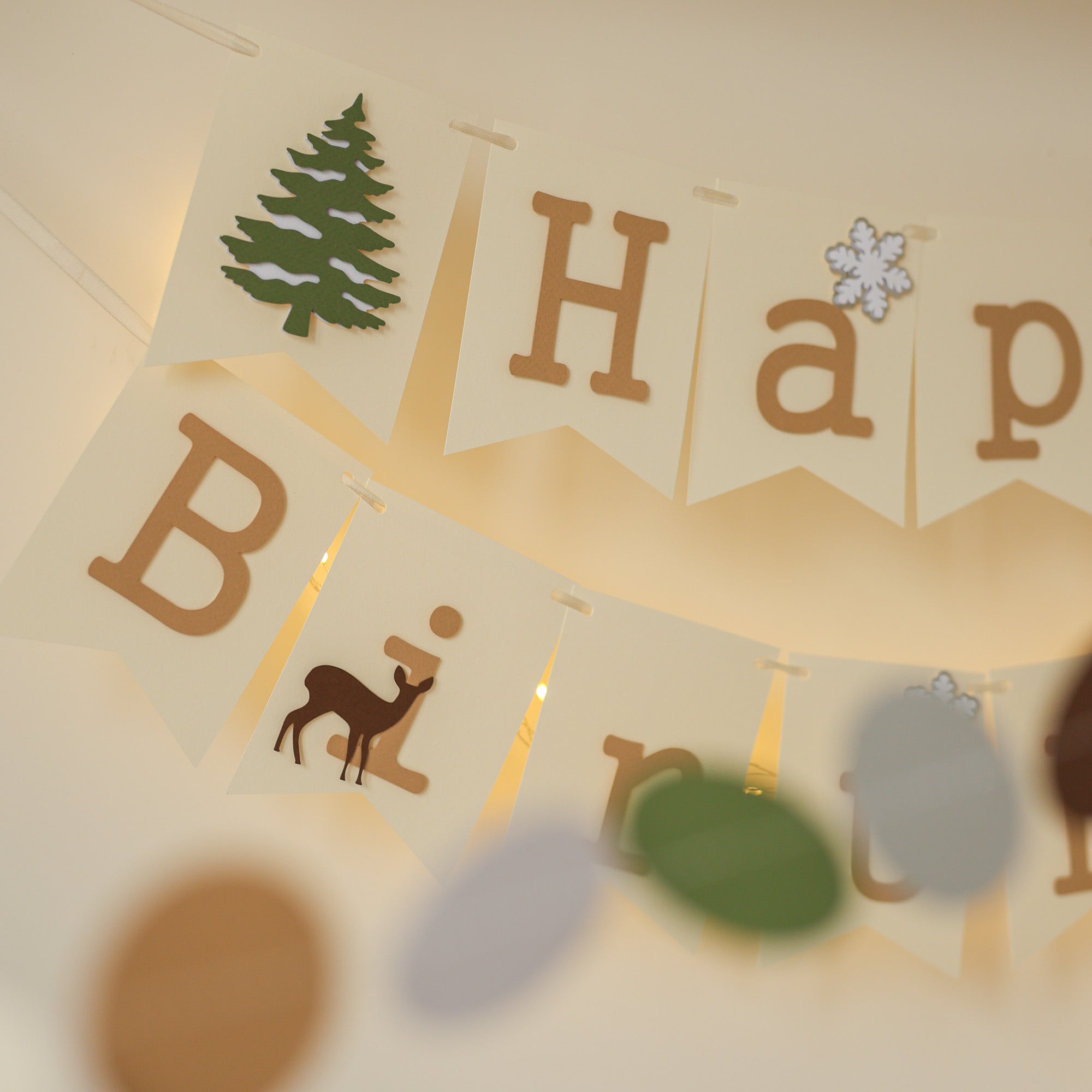Winter banner with deer silhouettes and snowy background.
