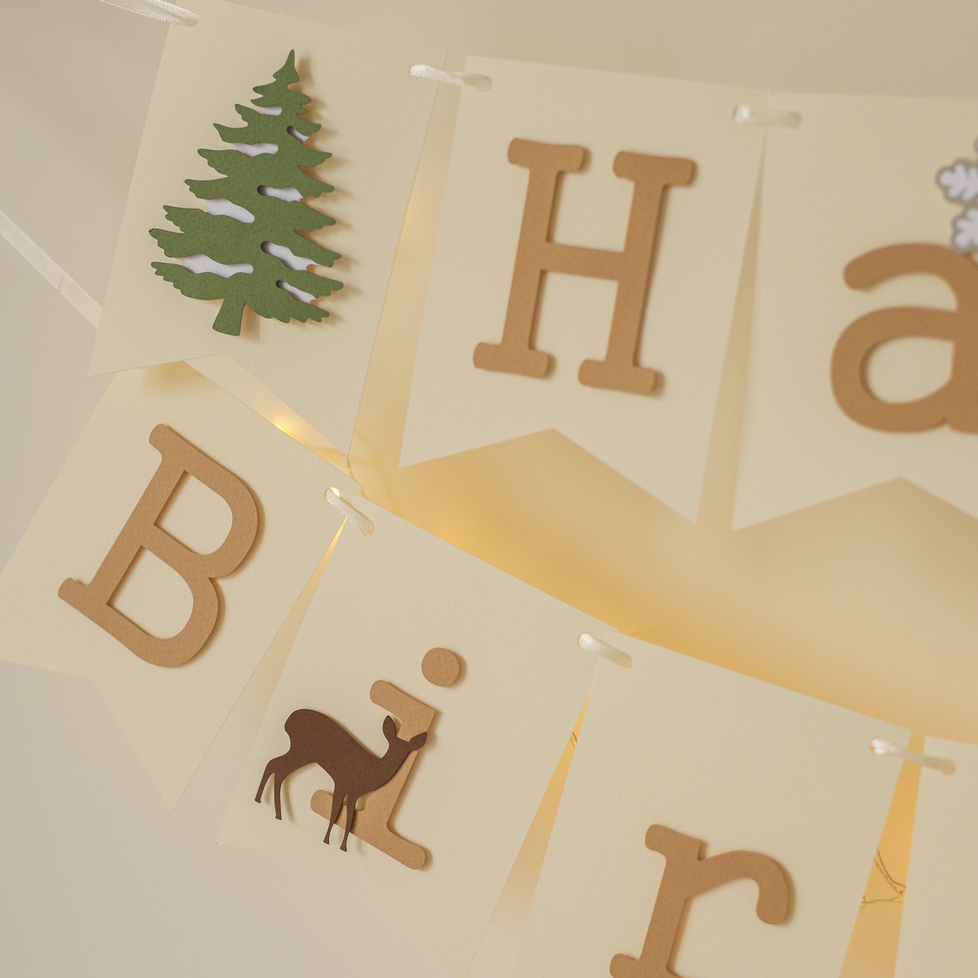 Winter banner with deer silhouettes and snowy background.