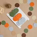 Handmade woodland paper garland set against a light background, earth tone party supplies for nature theme.