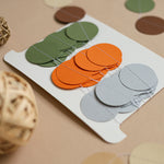 Handmade woodland paper garland set against a light background, earth tone party supplies for nature theme.