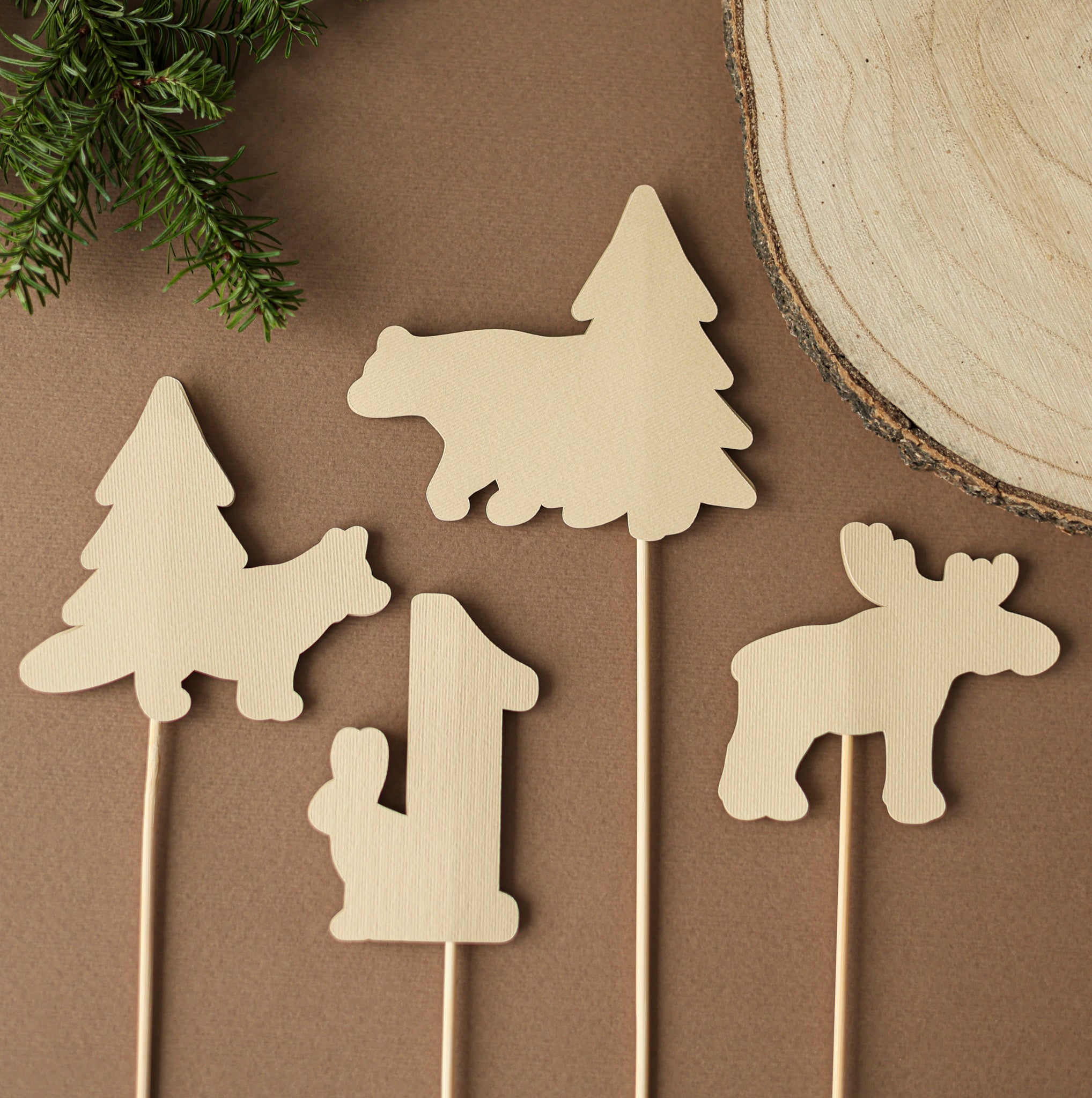 Back view of handmade woodland animal party picks showing sturdy wooden sticks and high-quality layered cardstock construction.