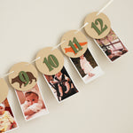 Woodland 12 month photo banner with forest animals and sage green numbers on Kraft paper circles for a baby's first birthday milestone display.