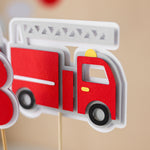 Decorative centerpieces with fire truck design and number.