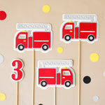 Decorative centerpieces with fire truck design and number.