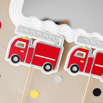 Red fire truck-shaped cupcake toppers