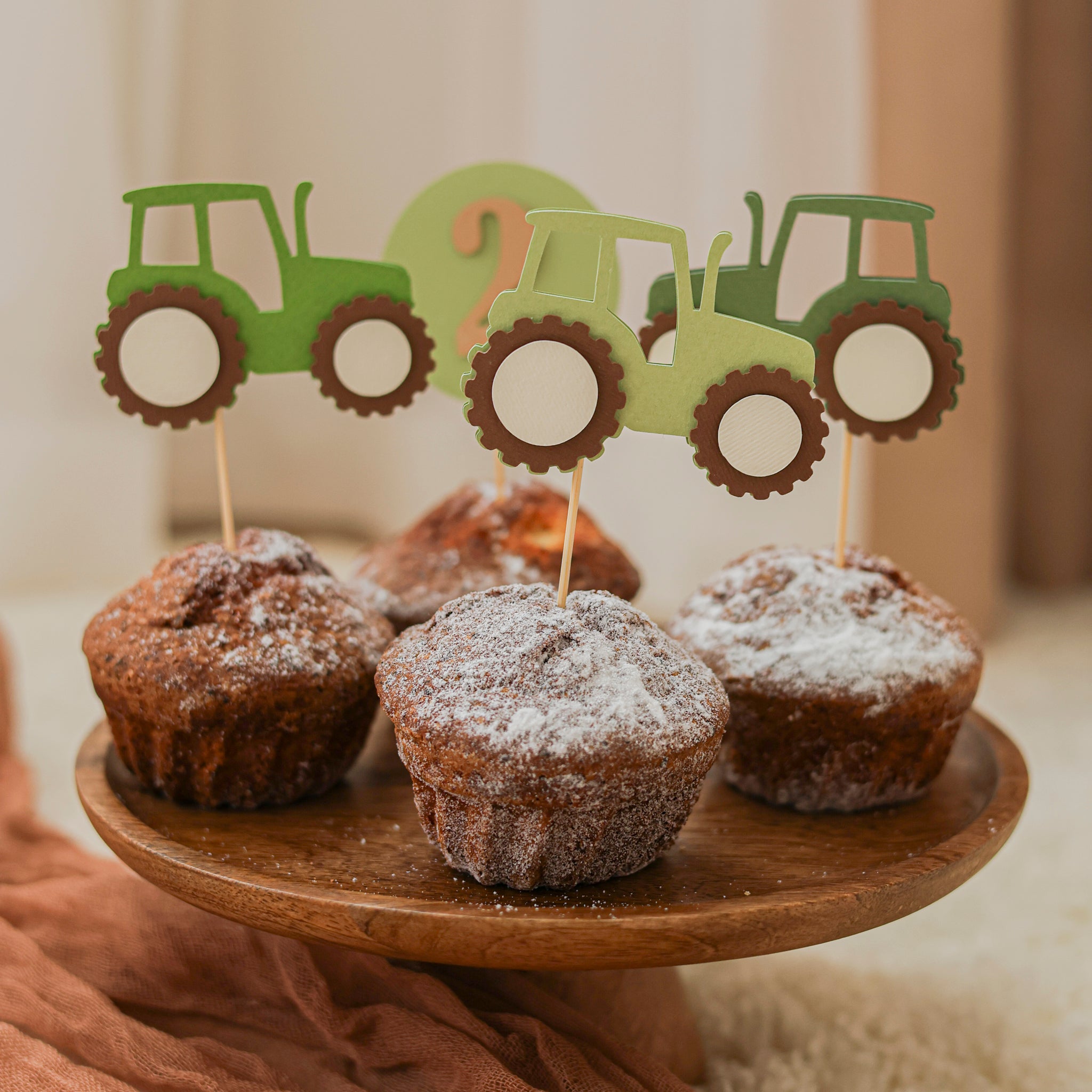 Close up detail of high quality cardstock tractor cupcake topper showing green farm design