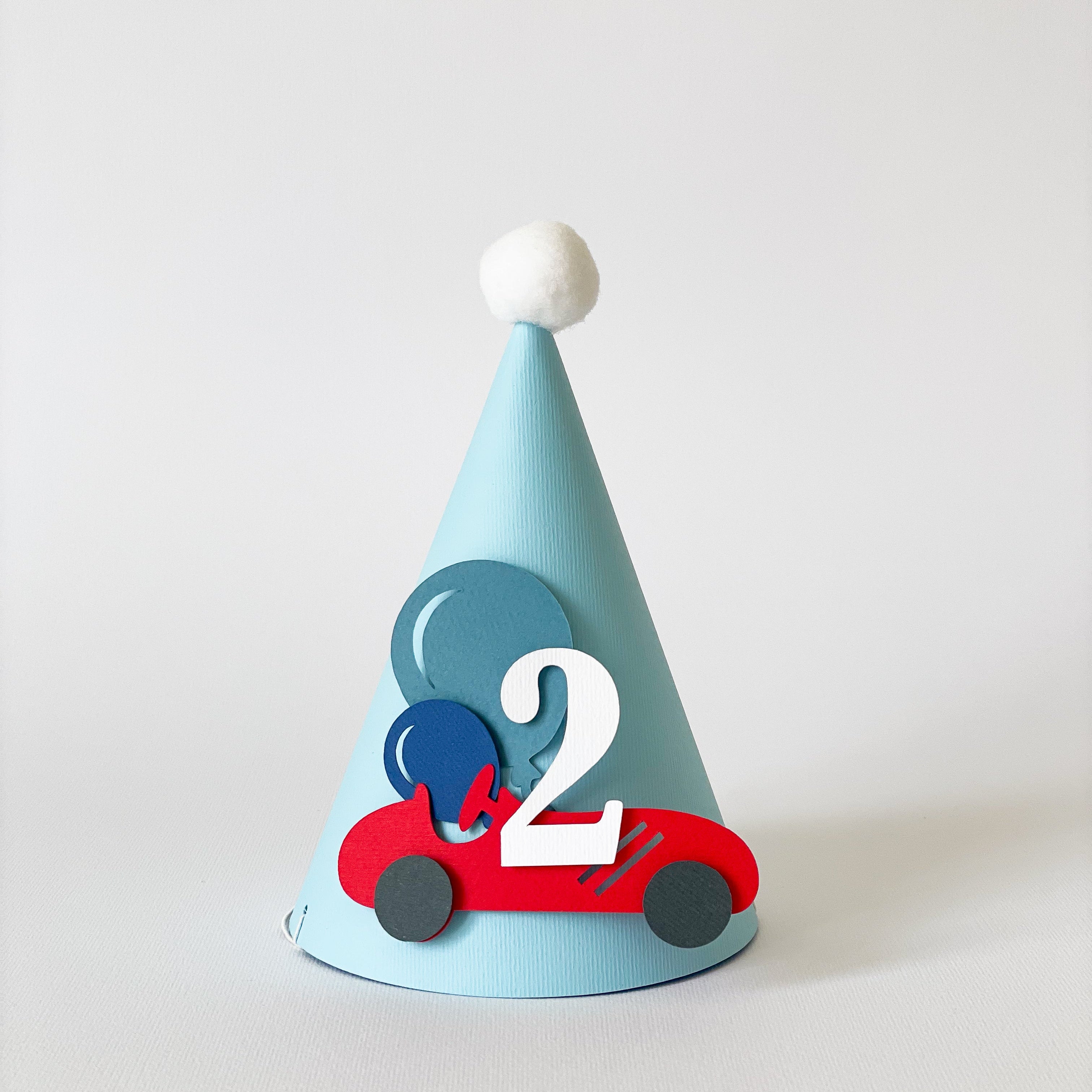 Children's party hat with number 2 and car design on a white background