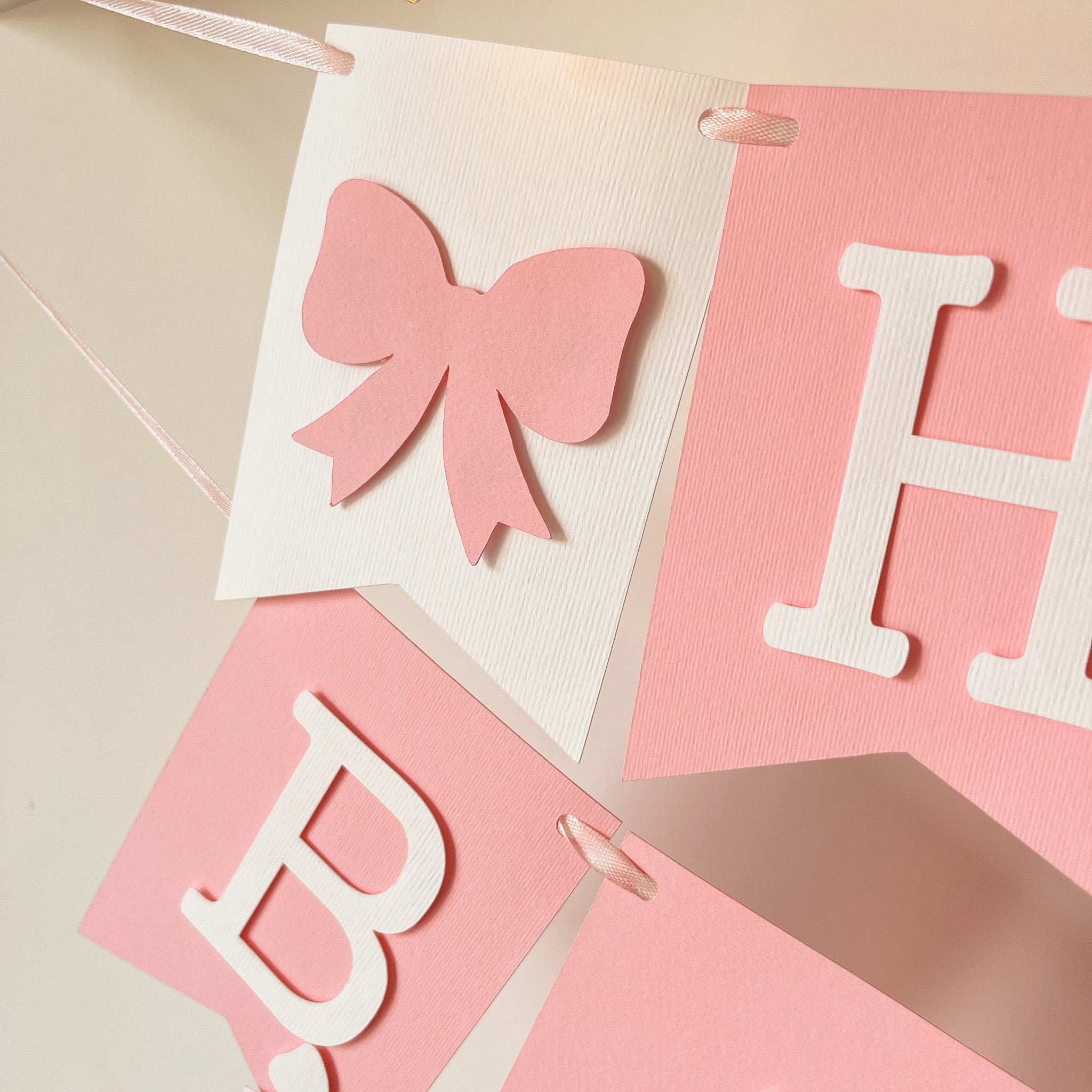 Detailed paper bow flag on pink birthday garland FunstaCraft