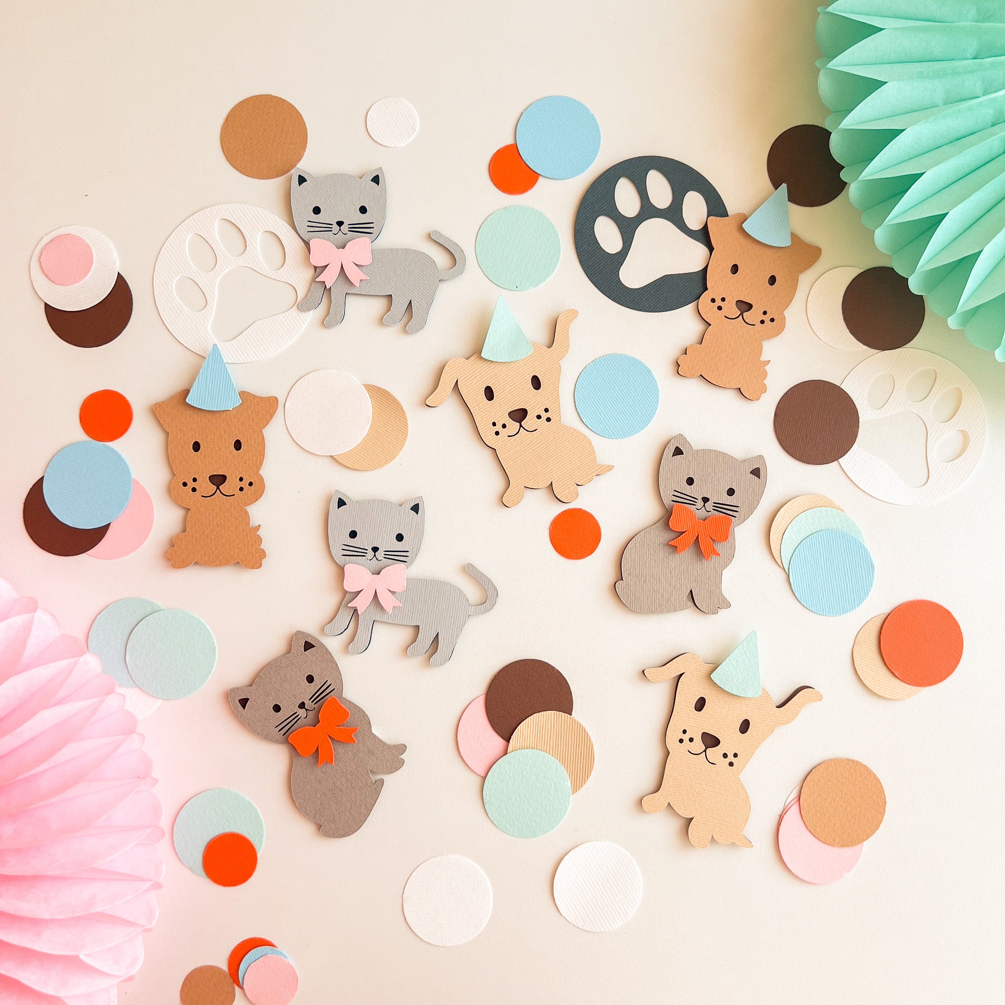 Colorful animal-themed decorations including cats, dogs, and paw prints on a light background.