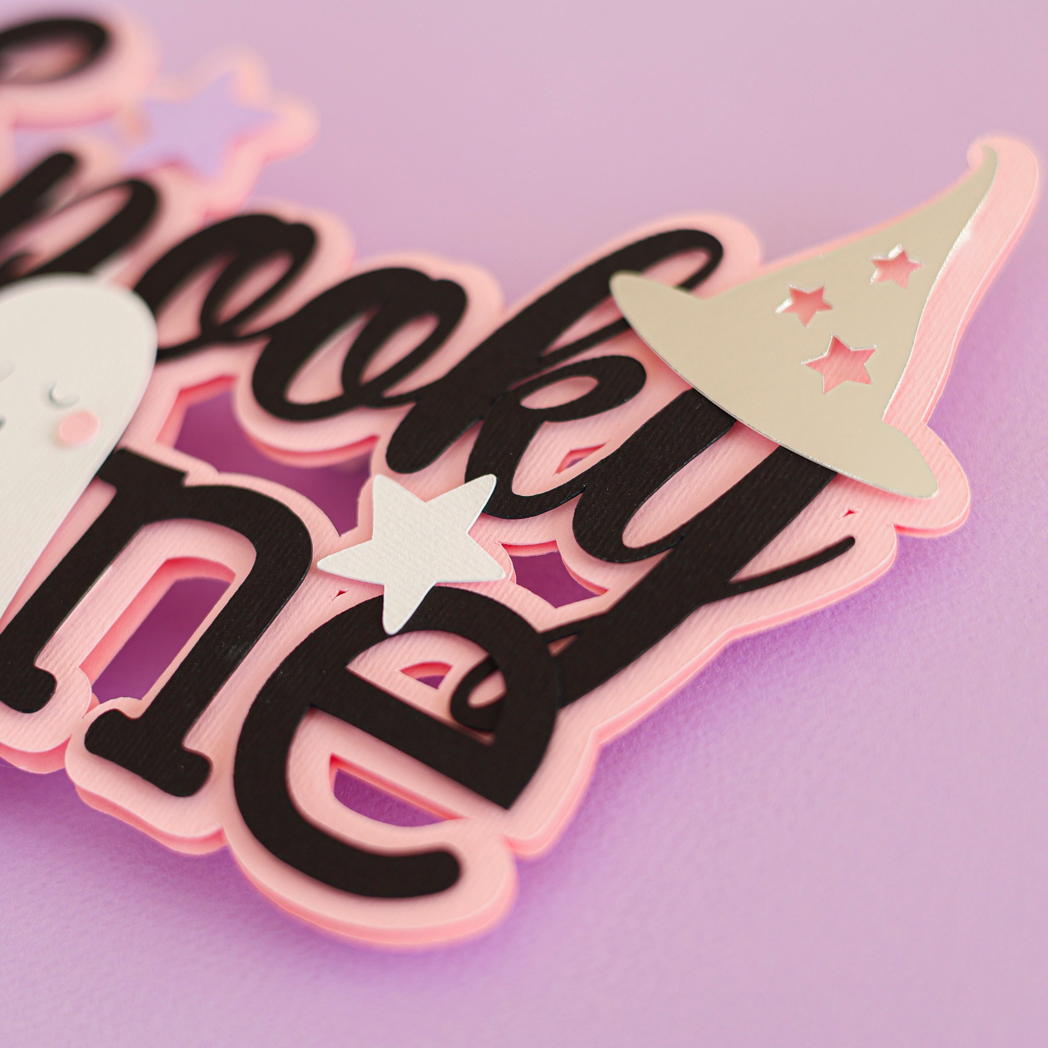 Halloween themed cake topper with 'Spooky One' text, ghost, and pumpkin for celebrating 1st Birthday 