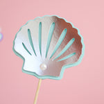 Shimmering silver paper seashell and light blue starfish with pearl centerpiece sticks for baby girl birthday