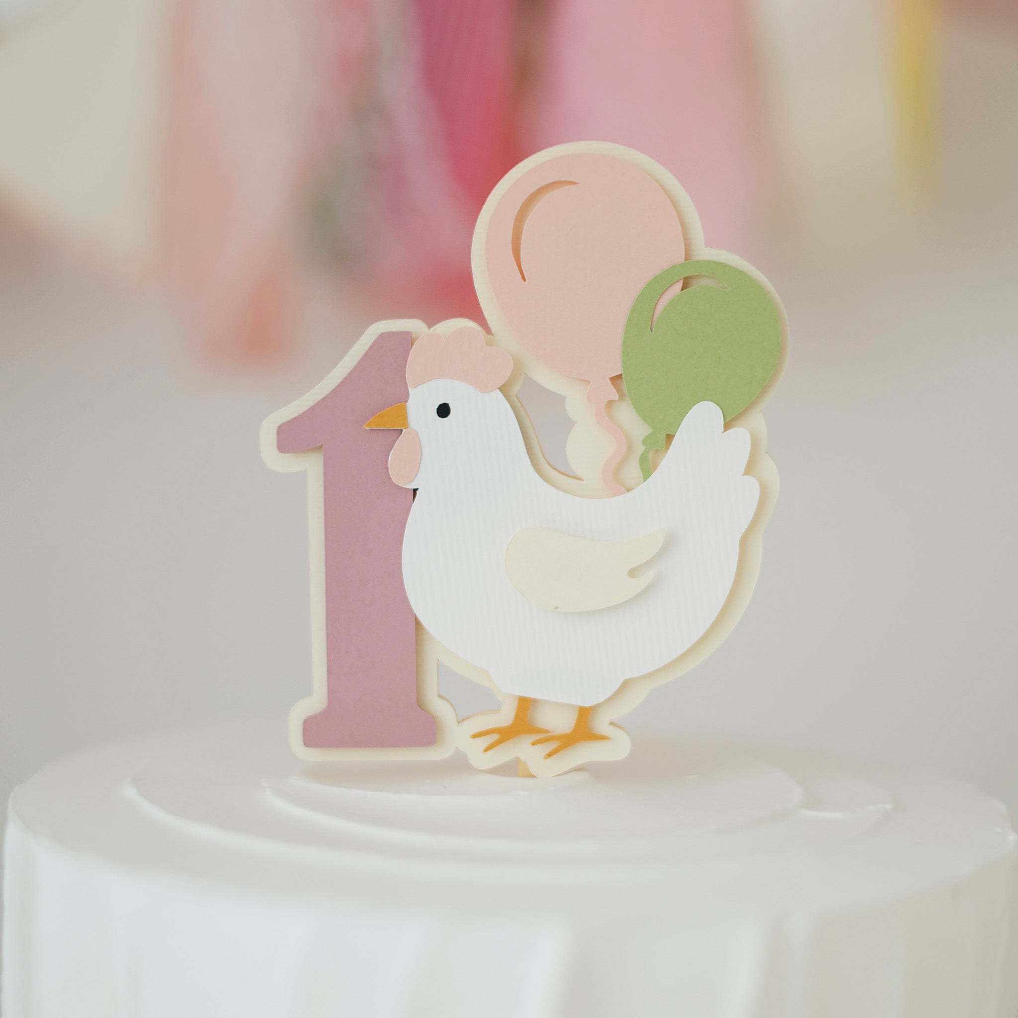 Cake topper with a chicken design and number '1' 