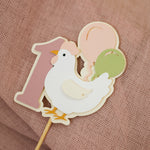 Decorative cake topper with a chicken 