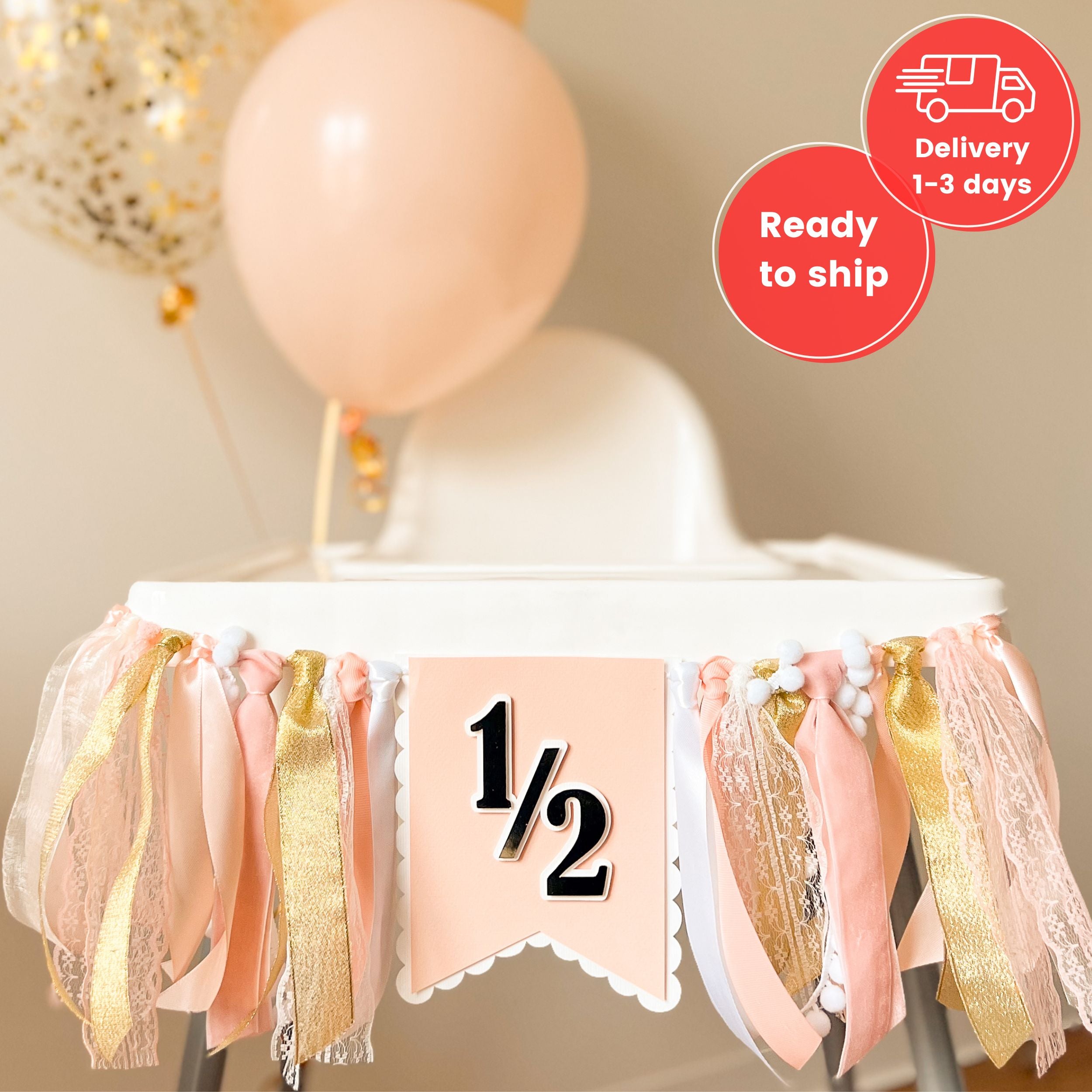 High chair with pink and gold decorations and a banner indicating '1/2' 