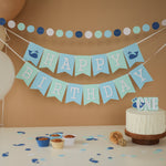 Handmade blue and mint whale birthday banner for a nautical themed first birthday party.