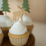 Assorted woodland creature cupcake picks in rustic colors for nature-themed party decorations.